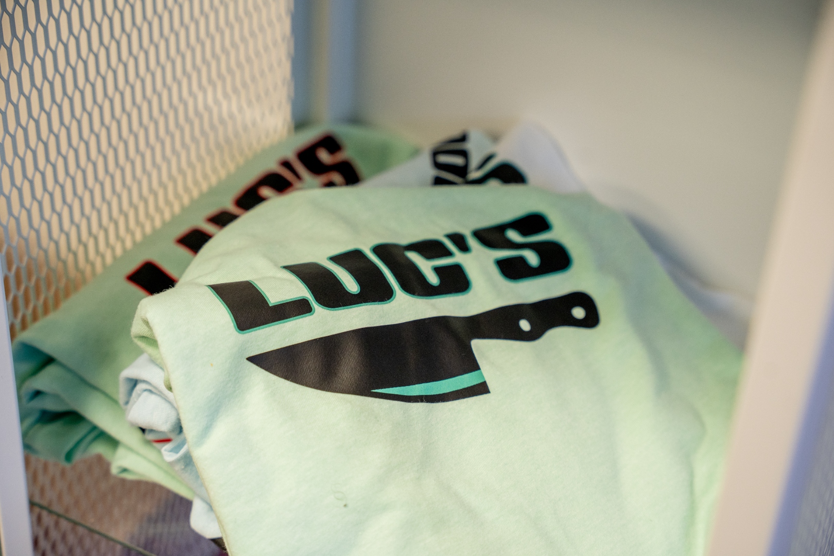 Luc's Seafood & Grill branded t-shirts available at the restaurant