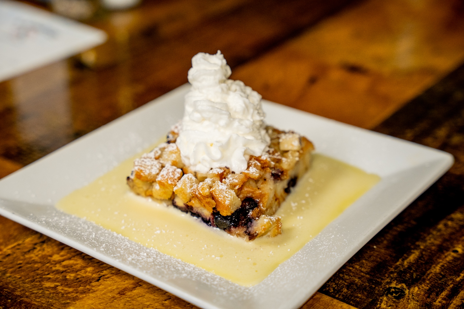 Bread pudding with vanilla cream and whipped cream